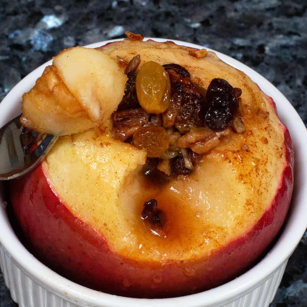 A simple oven-baked apple with a piece taken out