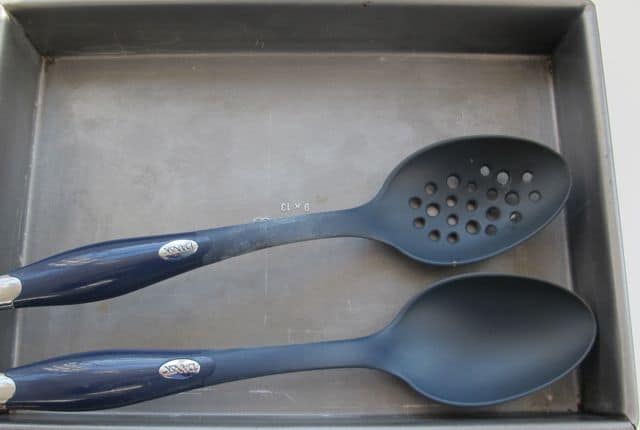 roasting pan and spoons used to broil slow cooker or crock pot chicken