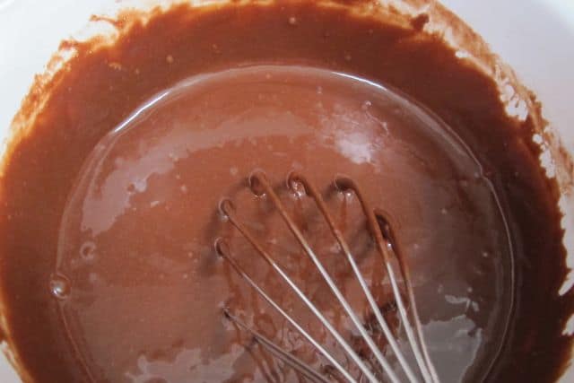 mixing the ingredients for glazed chocolate cupcakes