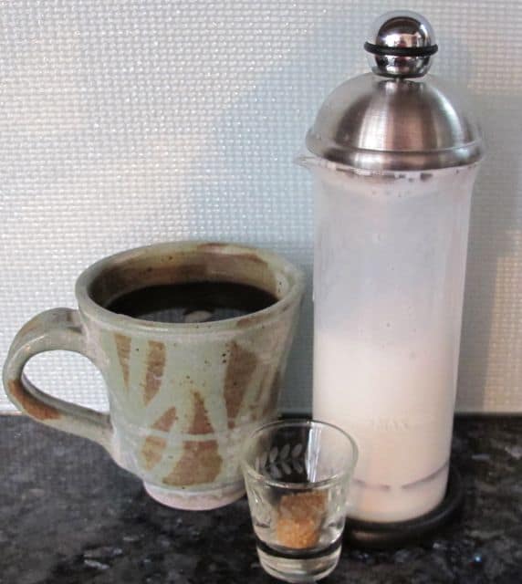 frothing up milk for coffee