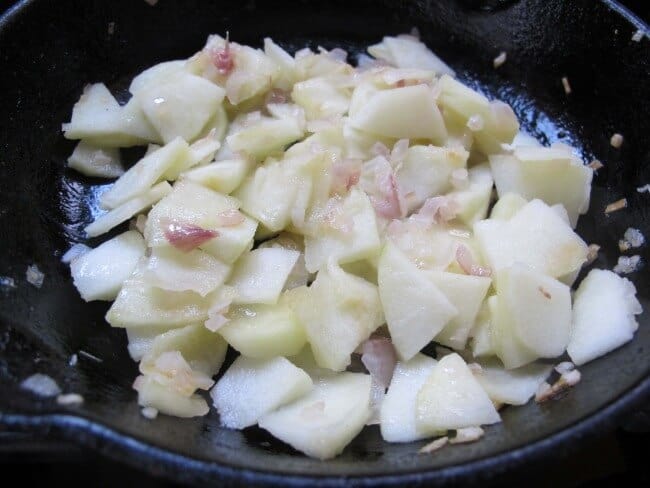 cooking shallots and apples for latkes