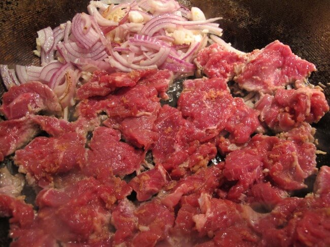 searing flank steak in a wok
