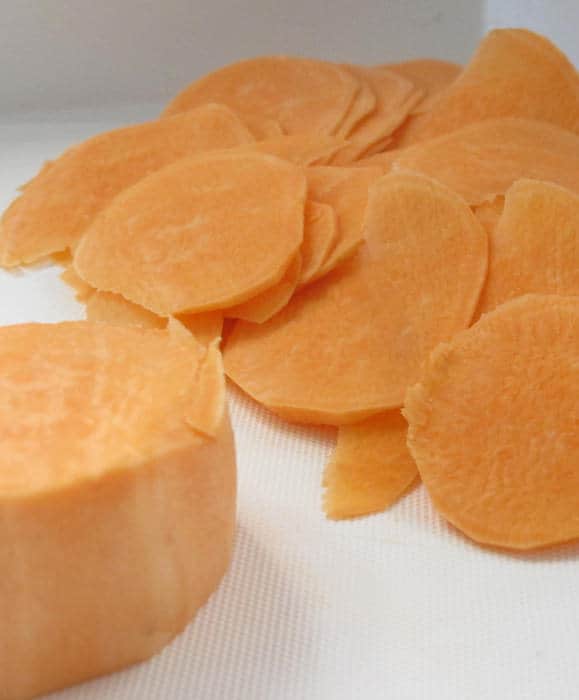 Slices of sweet potato ready for baking. 