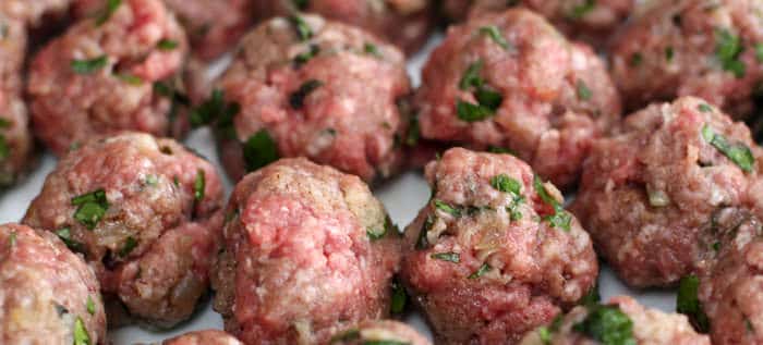 Lamb meatballs formed and ready to be cooked.