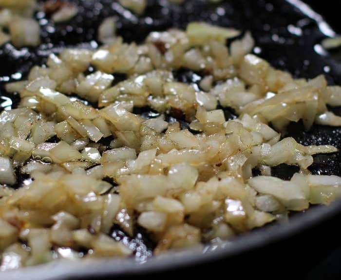 cooking chopped onions for stuffed poblano peppers