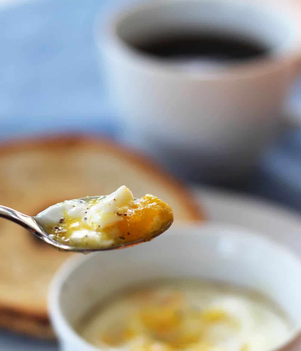 Shirred egg on a spoon - slightly liquidy and very delicious.