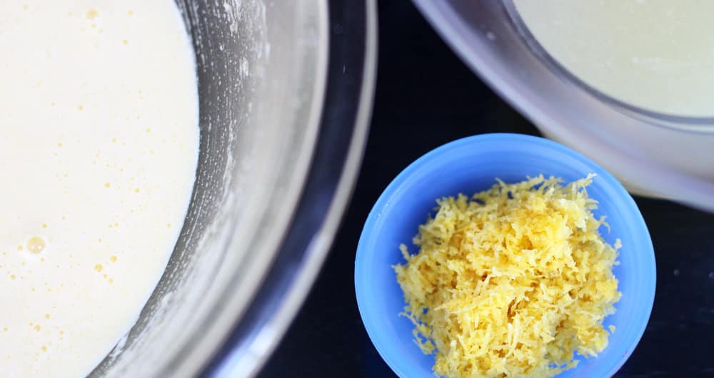 Adding lemon rind and juice to egg yolks and sugar for lemon chiffon mousse.