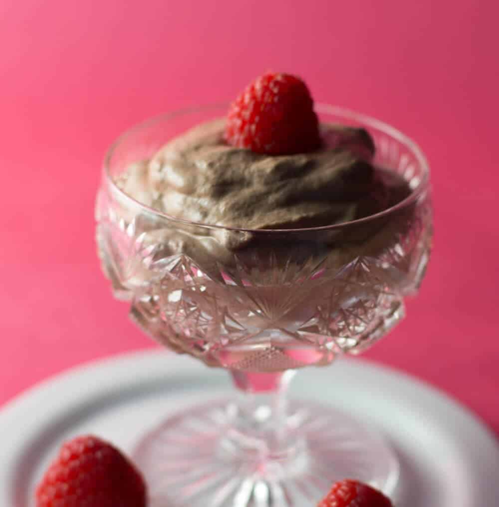 Creamy chocolate mousse with orange liqueur, served with raspberries.
