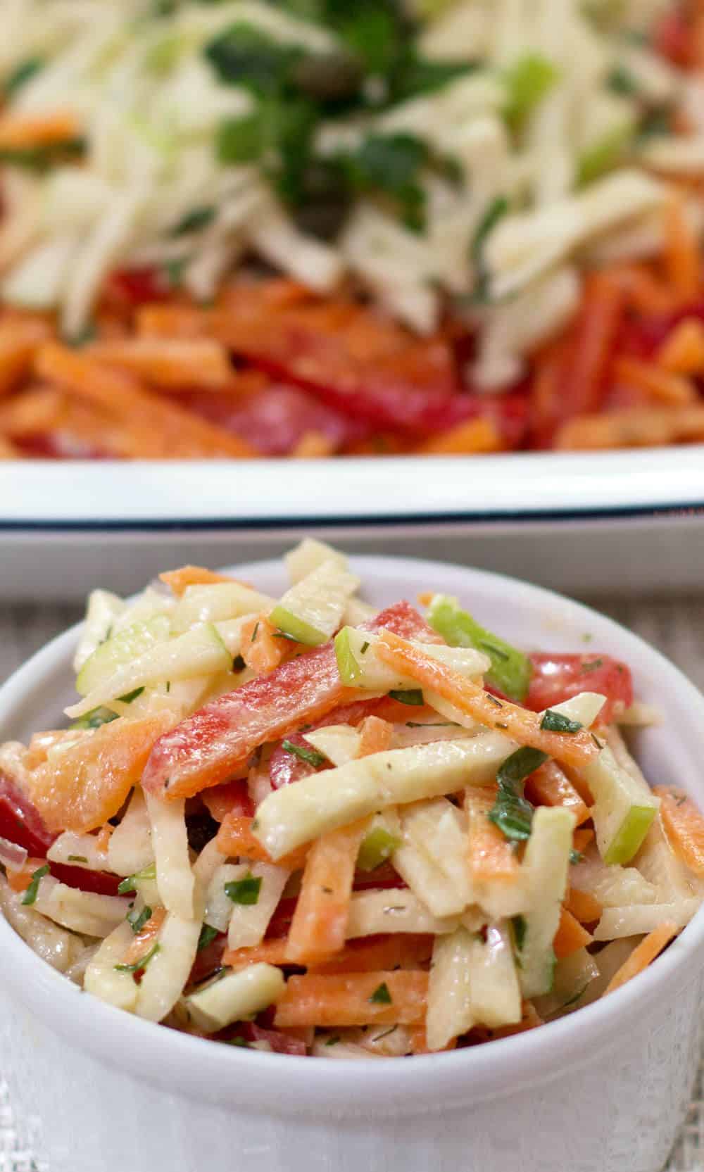Celery root carrot apple salad is a great way to keep healthy food in the refrigerator for snacking. 