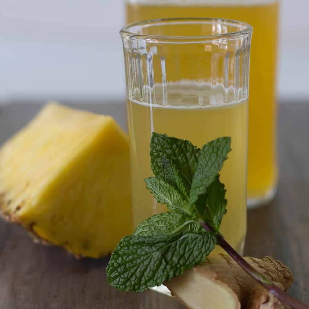 A glass of Pineapple Mint Shrub, ready to drink. 