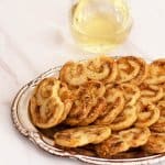 Spicy Cheddar Herb Palmiers, ready for the party, with wine. A perfect holiday appetizer. | Mother Would Know