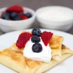 Jewish cheese blintzes for Shavuot with fruit and sour cream