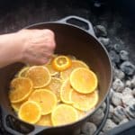 Adding orange slices to Cast Iron Orange Olive Oil Upside Down Cake