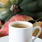 Acorn Squash Rum Punch heated with a cinnamon stick