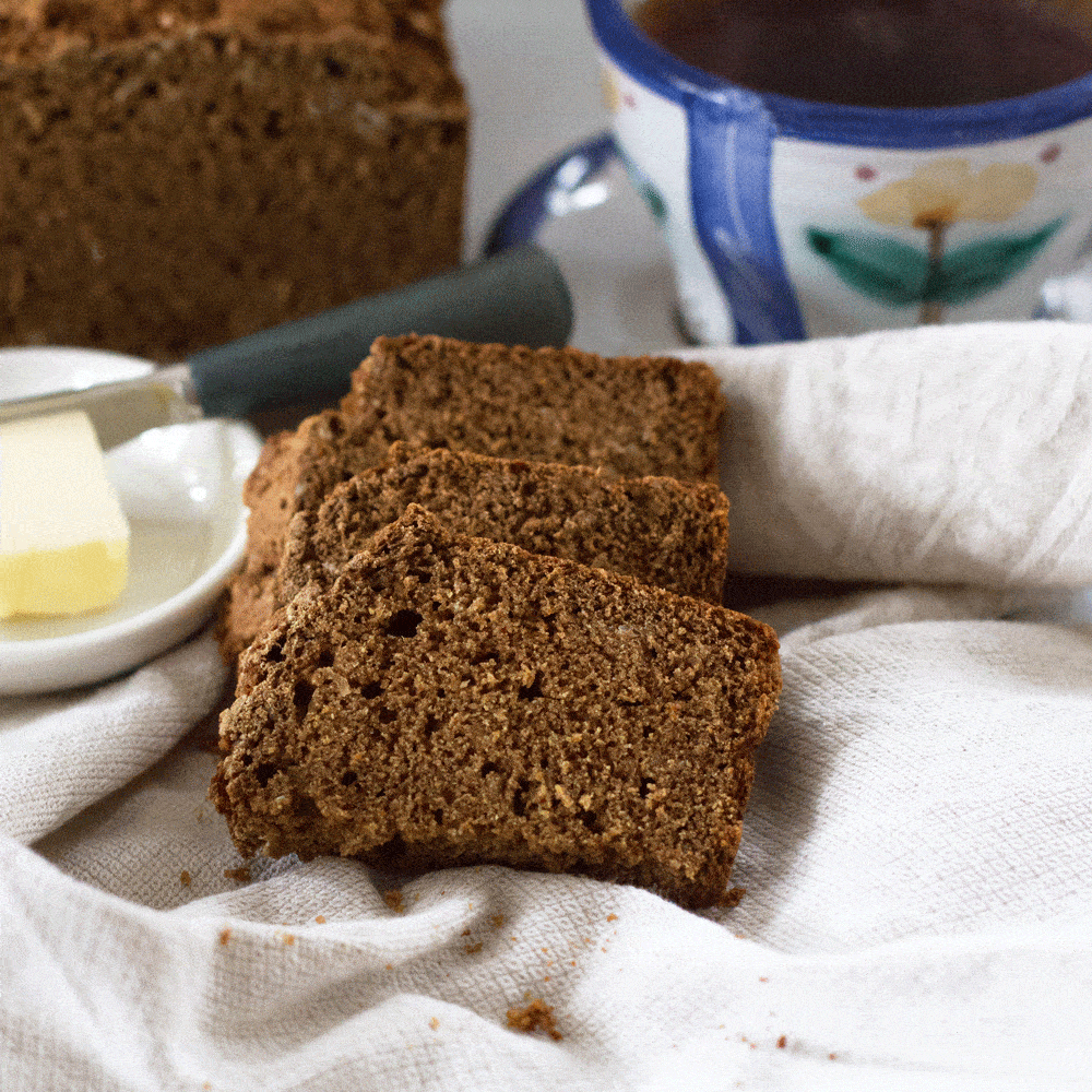 two slices of Irish Guinness brown bread with butter and tea