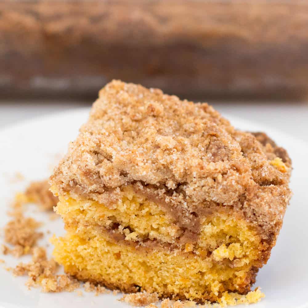 piece of sweet potato streusel cake in front of pan