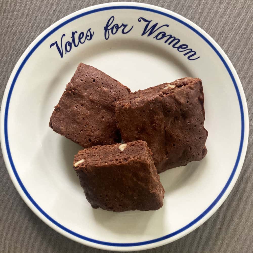 old fashioned chocolate walnut brownies on a "Votes for Women"
