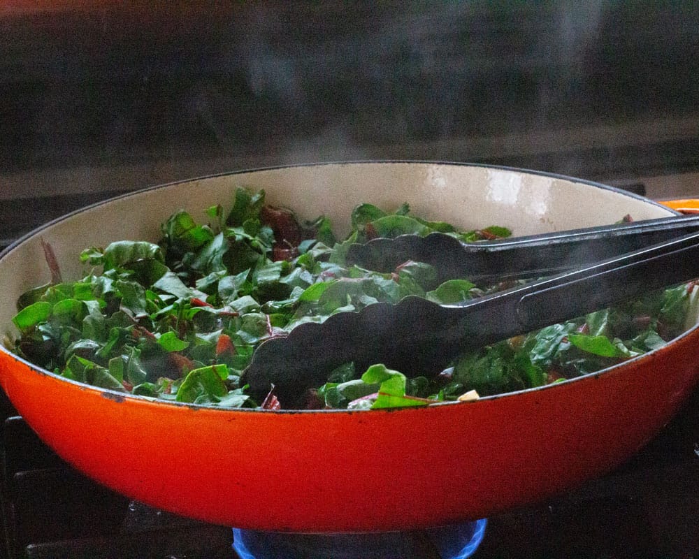 Swiss chard leaves cooking down