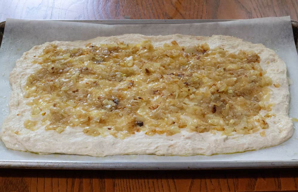 pletzel dough with onions on top