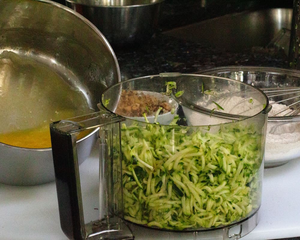 mixing zucchini into wet ingredients