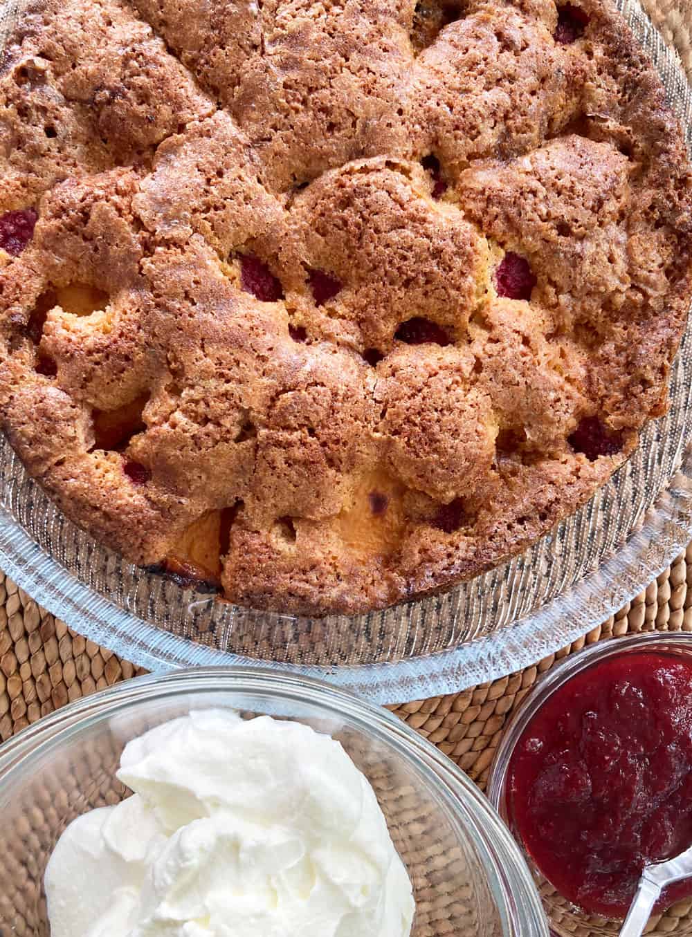Summer Fruit Cornmeal Cake with whipped cream and fruit sauce on the side e
