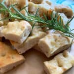 pizza bianca (white pizza) with a sprig of rosemary