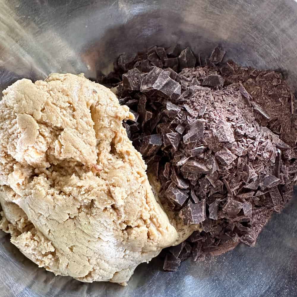 batter and chopped chocolate ready to combine for miso tahini chocolate chunk cookies
