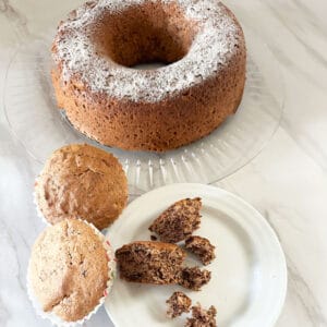 Passover walnut cake with muffins on side and open muffin in front