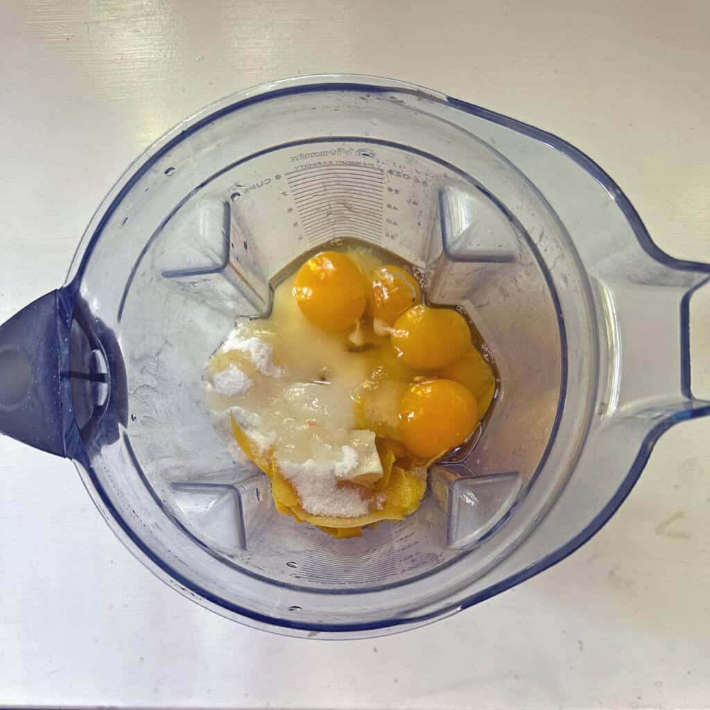 ingredients of simple and easy lemon curd except for butter in the Vitamix before blending