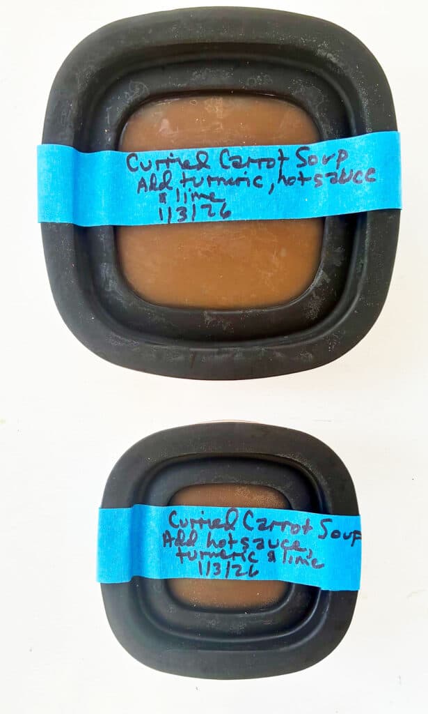 2 containers of soup - one small above and the one below is larger